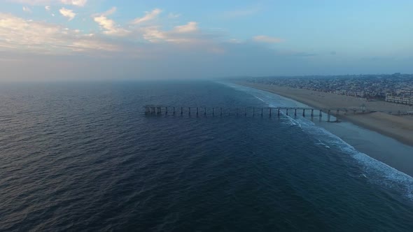 Aerial shot of waves breaking on the beach.