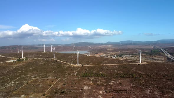 Drone Flies Over a Windmill Park