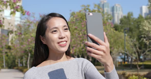 Woman having video call on cellphone