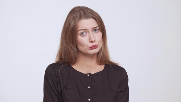 Young Beautiful Fairhaired Girl Begging Over White Background