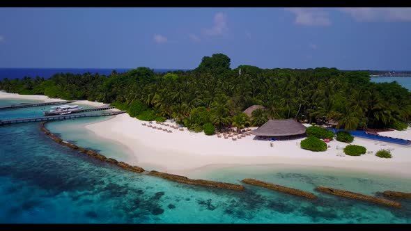Aerial drone seascape of exotic shore beach vacation by blue water with white sand background of jou