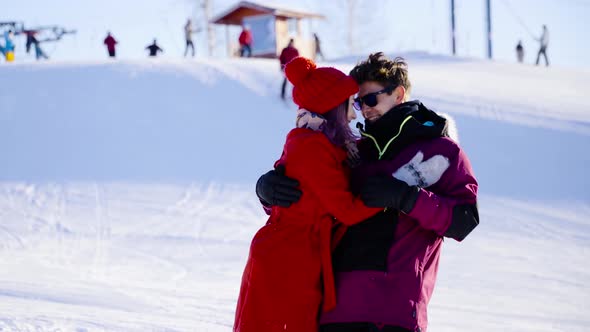 Coulple in Love in Mountain Ski Resort at Sunny Day