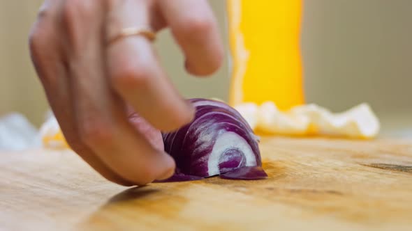 The Chef Cuts Red Onions Into Slices with a Professional Knife