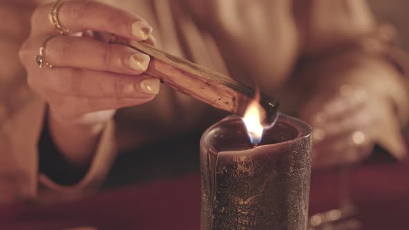 Fortune Teller Blowing out Palo Santo Stick