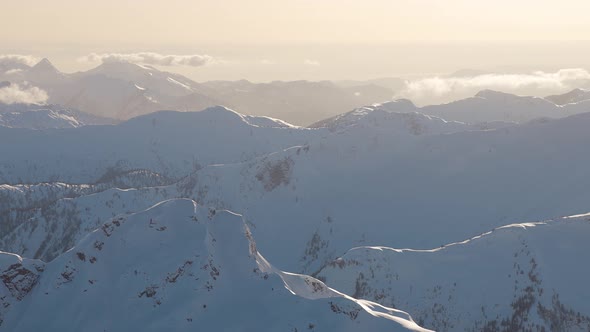 Aerial View From an Airplane of Beautiful Snowy Canadian Mountain Landscape