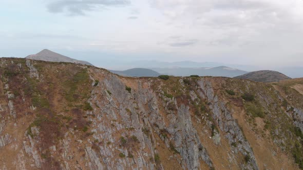 Aerial Flying Through a Mountain Ridge with Cliffs