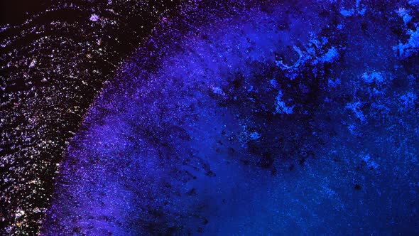 Dark Neon Blue Purple Black Colors Ink and Shiny Particles Macro