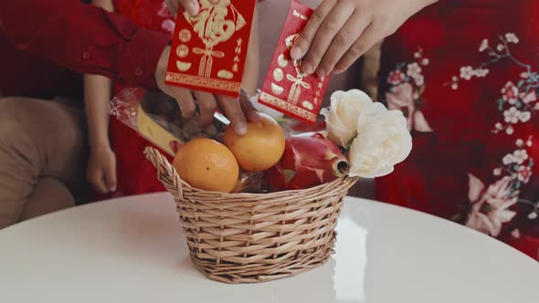 Chinese Family Making Gift Basket for Lunar New Year