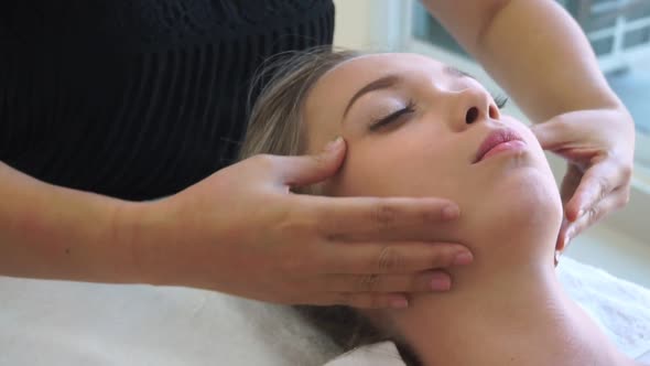 Woman Gets Facial and Head Massage in Luxury Spa