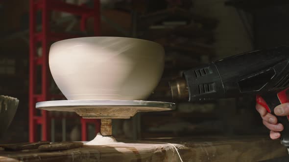 Raw Clay Pot Is Rotating On Pottery Wheel and Dried