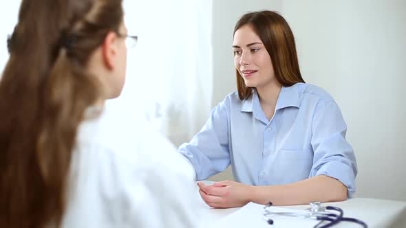 Woman patient at a doctor's consultation.