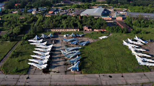 Top view of the planes at the airfield. Many old, broken aircraft are at the airfield.