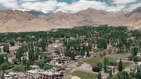 the leh city with house made of mud and local materials crowded the Buddhist flag fluttering due to