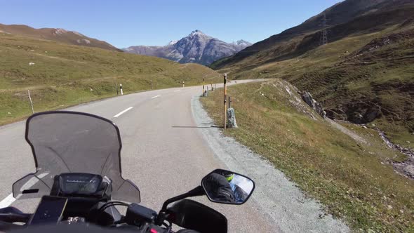 POV Biker Rides on Motorbike By Scenic Mountain Pass in Swiss Alps Moto Trip