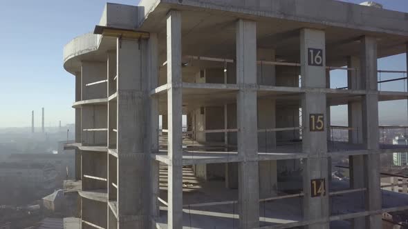 Aerial View of Concrete Frame of Tall Apartment Building Under Construction in a City