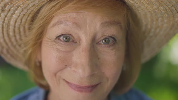 Closeup Face of Happy Senior Caucasian Woman Looking at Camera Smiling