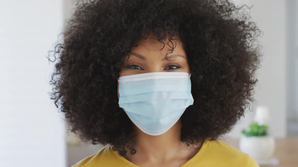 Woman wearing face mask at home