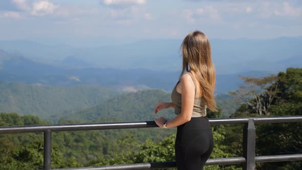 Woman Enjoy View on Mountains From Viewpoint