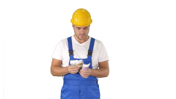 Builder Counting Money Standing on White Background