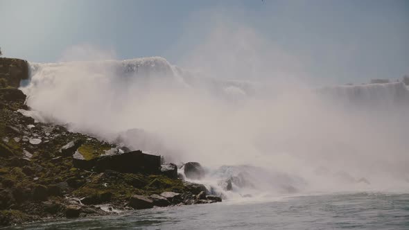 Scenic Slow Motion Background Shot of Epic Waters Rushing Down at Amazing Niagara Falls Waterfall