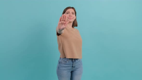 Close Up of Young Woman Making Stop Gesture with Her Hand.