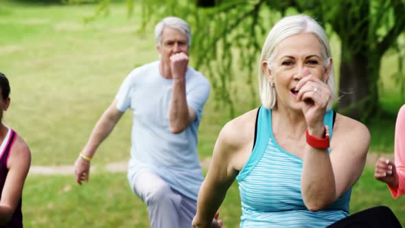 Group of people exercising together in the park