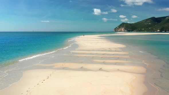 Wonderful Beach Amidst the Deep Blue Sea and the Green of the Hills