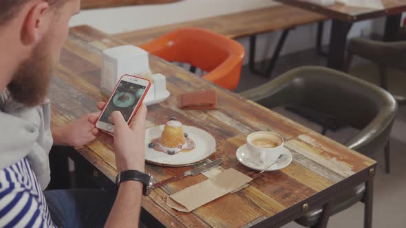 Customer of Coffee Shop Is Photographing Delicious Dessert on Table