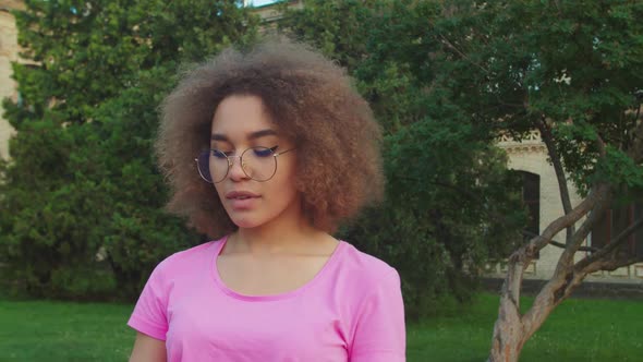 Closeup Portrait of Teenage Mixed Race Girl in Eyeglasses Outdoors