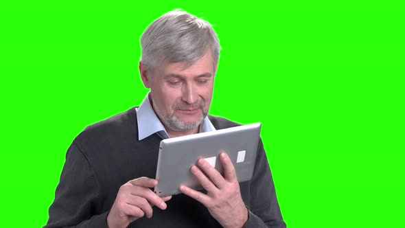 Portrait of Handsome Man Using Digital Tablet.