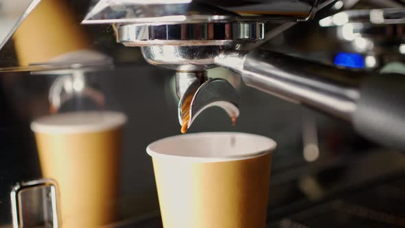 Extraction of Espresso Coffee From the Double Holder of the Coffee Machine Into a Disposable Paper