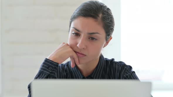 Close Up of Indian Woman Thinking and Working on Laptop 
