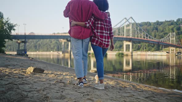 African American Man Walks with Girlfriend Throwing Trash