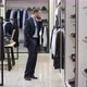 A Side View General Shot of a Dark Haired Business Man Choosing a New Clothing Style for Himself and - VideoHive Item for Sale