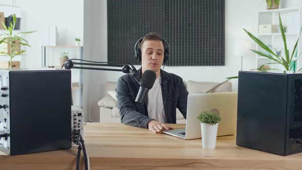 Content Creator Social Media Influencer Hosts a Podcast While Working
