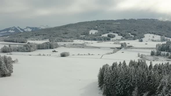 Aerial of beautiful snow covered landscape in Vaud, Switzerland