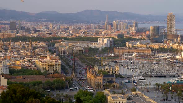 Panorama of Barcelona, Spain By the Sea Coast Shot From a High Point at Sunset. Cars and Buses Are