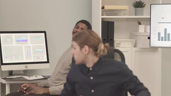 Diverse Colleagues Talking at Workplace