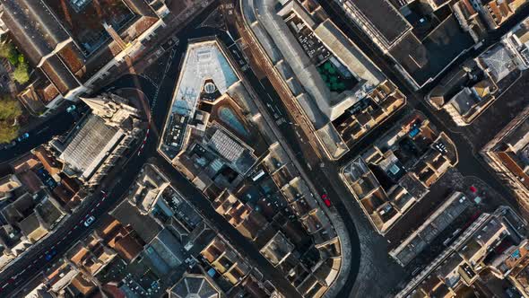 Top down drone shot of old building blocks and streets in Bath city centre UK