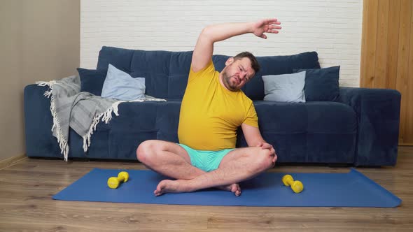 Plump Man with Beard is Doing Physical Exercise for Weight Loss