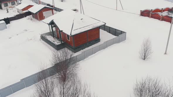 Modern Cottage in Countryside in Winter Aerial View