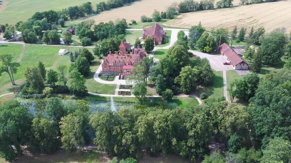 Jaunmoku Brick Medieval Castle Near Tukums, Latvia  Aerial Dron 4k Shot Jaunmokas Manor Park.