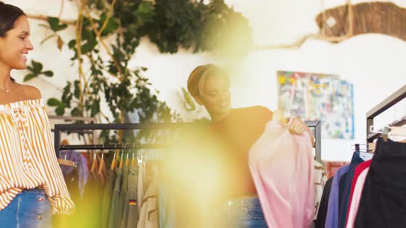 Women Choosing Clothes at Vintage Clothing Store 