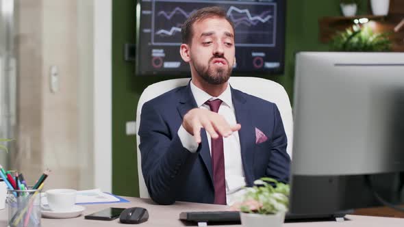 Businessman in Modern Office Having a Video Call Converstation