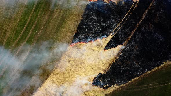 Aerial top view of Wildfire in Cornwall, South Africa. Dry grass burning in Bartinney