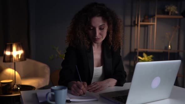 Lovely Business Lady Working Late in the Office