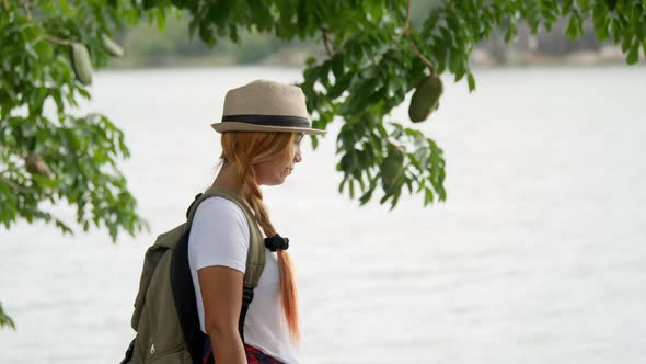 Woman with a backpack walking relax and refresh the air