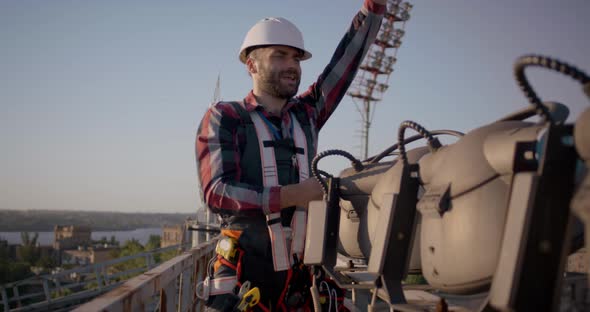 Engineer Working on a Cellular Tower