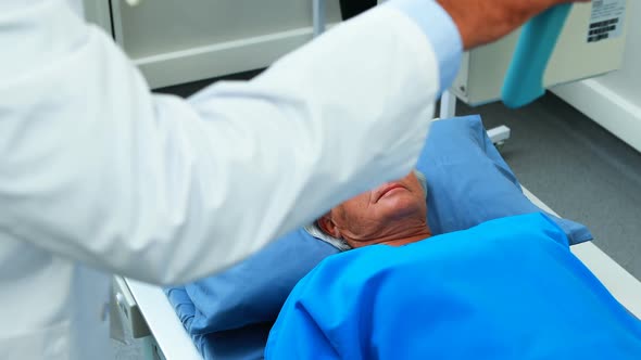 Senior woman undergoing an x-ray test