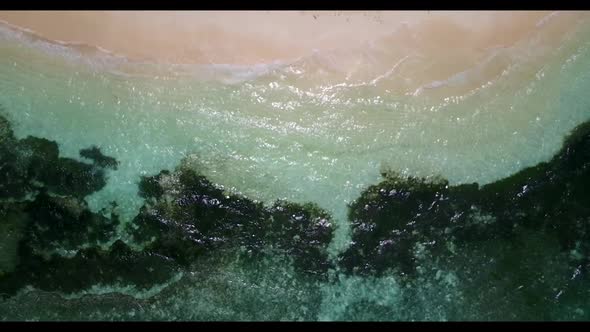 Aerial scenery of paradise shore beach lifestyle by blue water with white sand background of a dayou